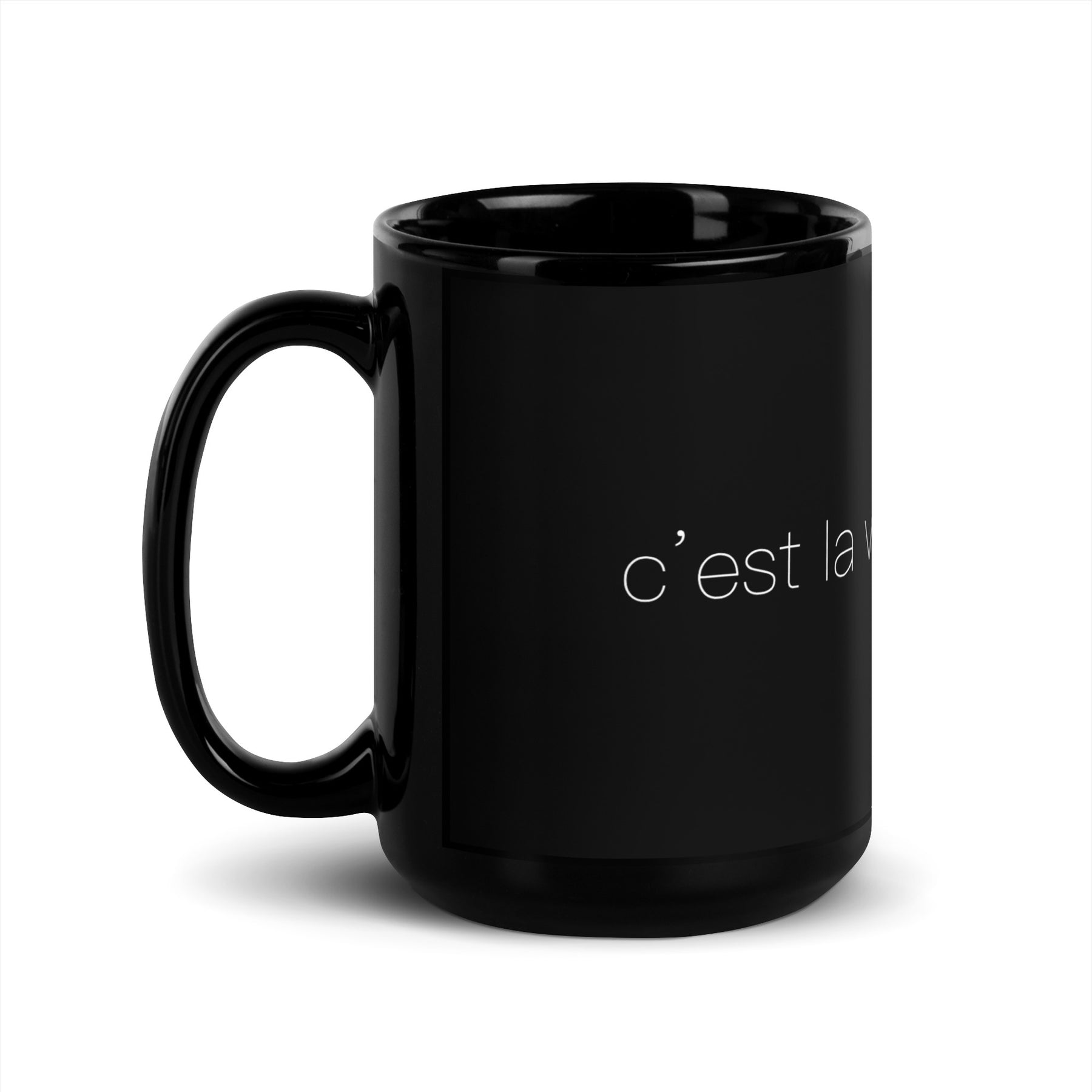 Side view of a black mug that says "c'est la vie, mon chéri"