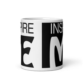 view of a black and white mug that says "inspire me"