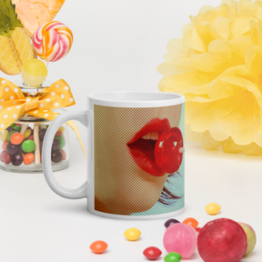 coffee mug with image of a girl with a red lolly pop in a pop art style in a table setting