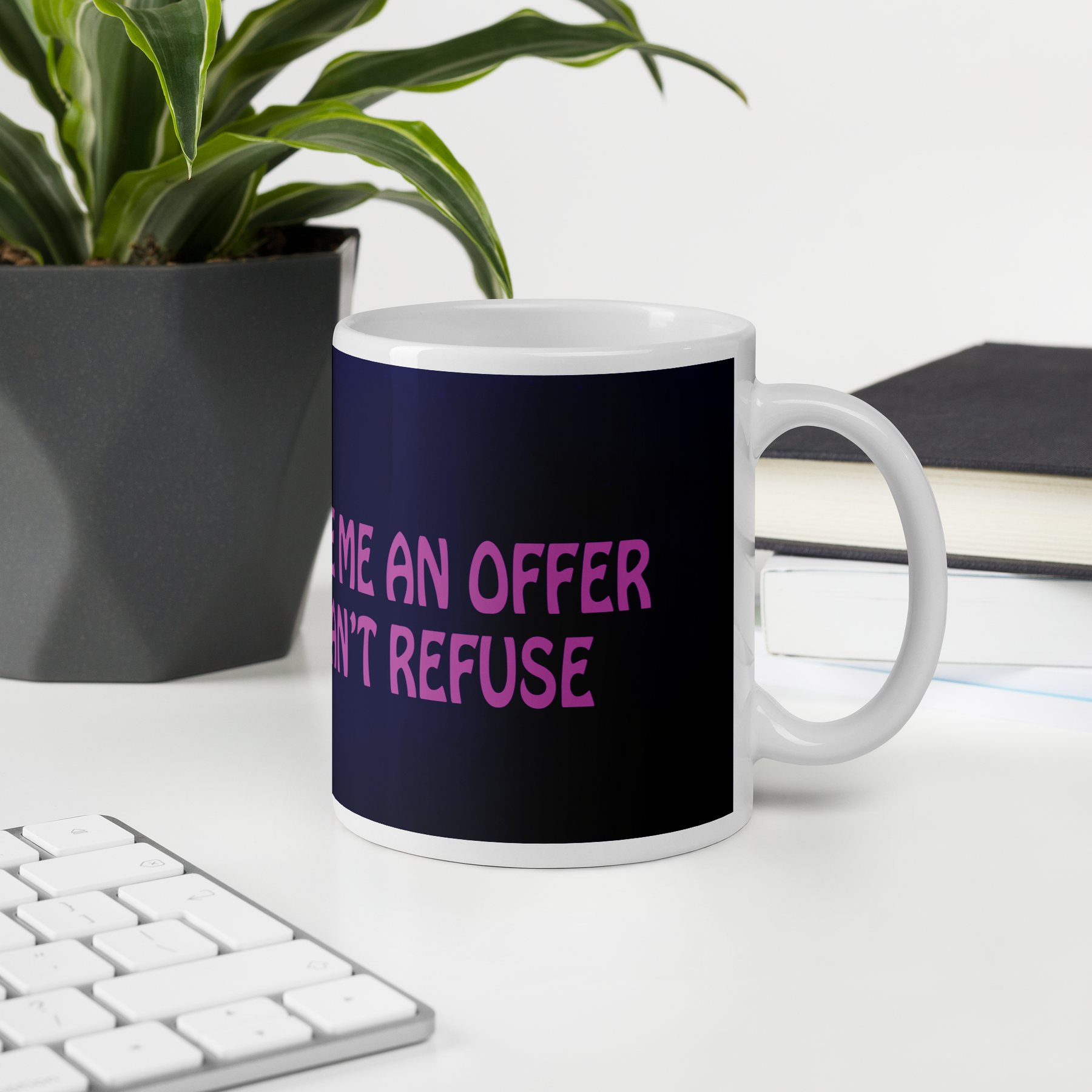 coffee mug on a desk with a purple wrap and an image of a young woman in sunglasses. There is pink text that reads Make Me An Offer I Can't Refuse