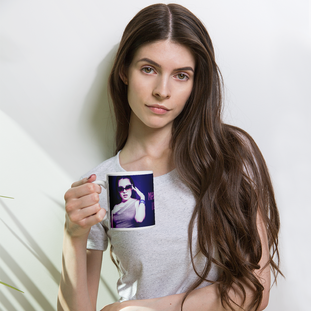 woman holding a coffee mug with a purple wrap and an image of a young woman in sunglasses. There is pink text that reads Make Me An Offer I Can't Refuse