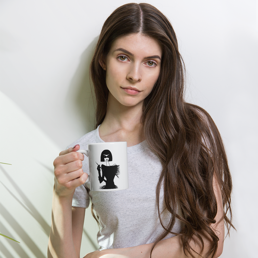 young woman holding a coffee mug with an ink drawing of a 1920's woman in a mask and holding a long cigarette