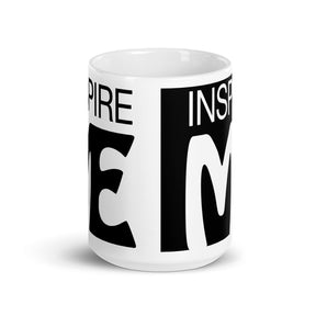 side view of a black and white mug that says "inspire me"