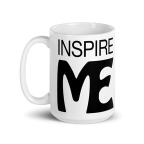 view of a black and white mug that says "inspire me"