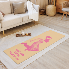 living room view of a muted yellow Yoga Mat with a young woman jumping in the air with the words Got NO Time For You- both the woman and words are pink