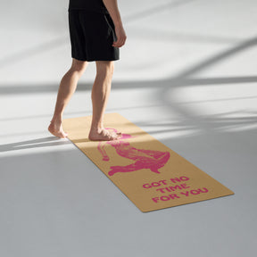 man walking on a muted yellow Yoga Mat with a young woman jumping in the air with the words Got NO Time For You- both the woman and words are pink