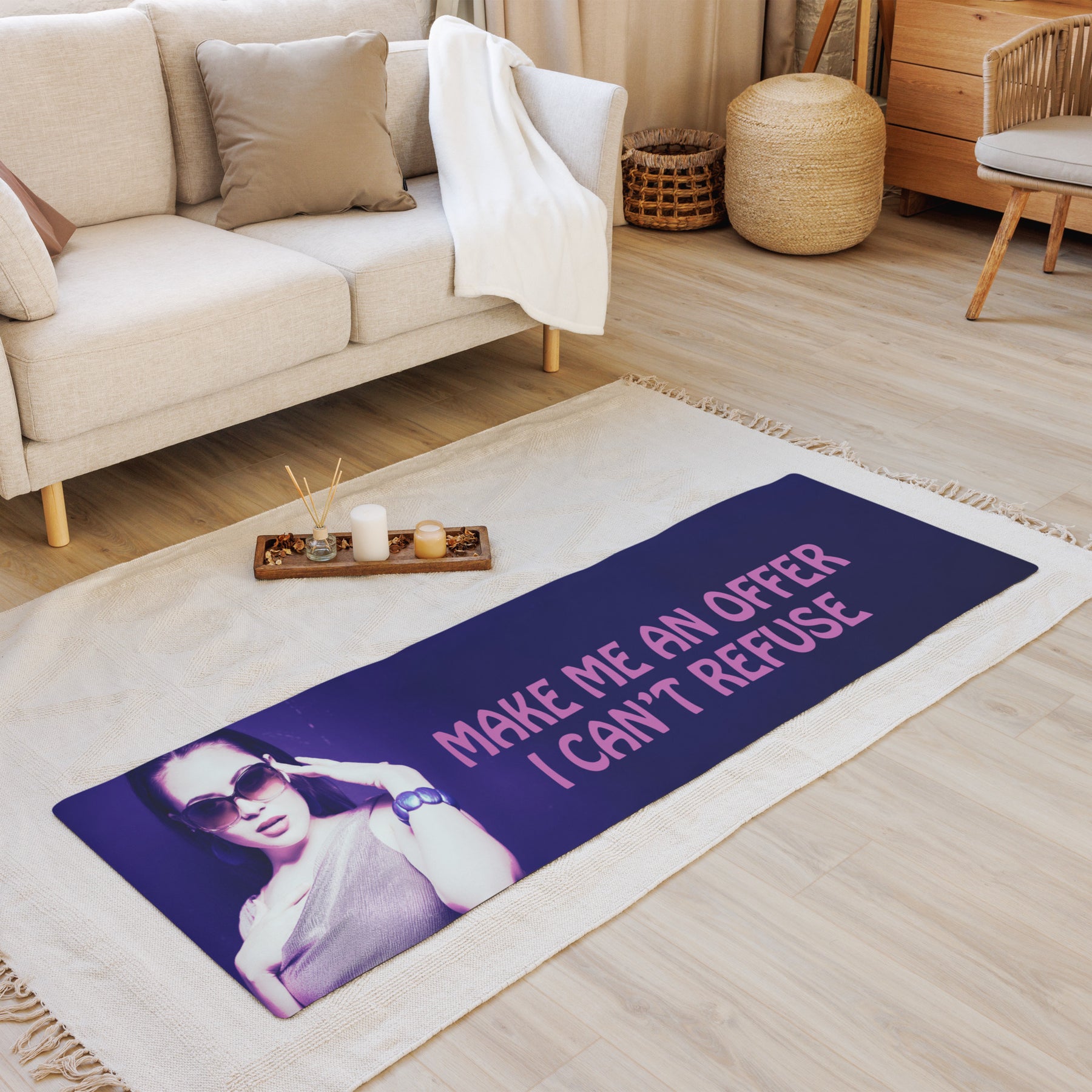 Interior zen room with a Yoga mat with a purple wrap and an image of a young woman in sunglasses. There is pink text that reads Make Me An Offer I Can't Refuse