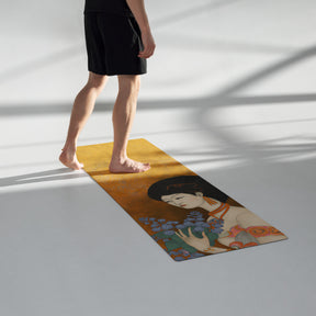 man walking on a Yoga Mat with a painted image of a Geisha holding some violets