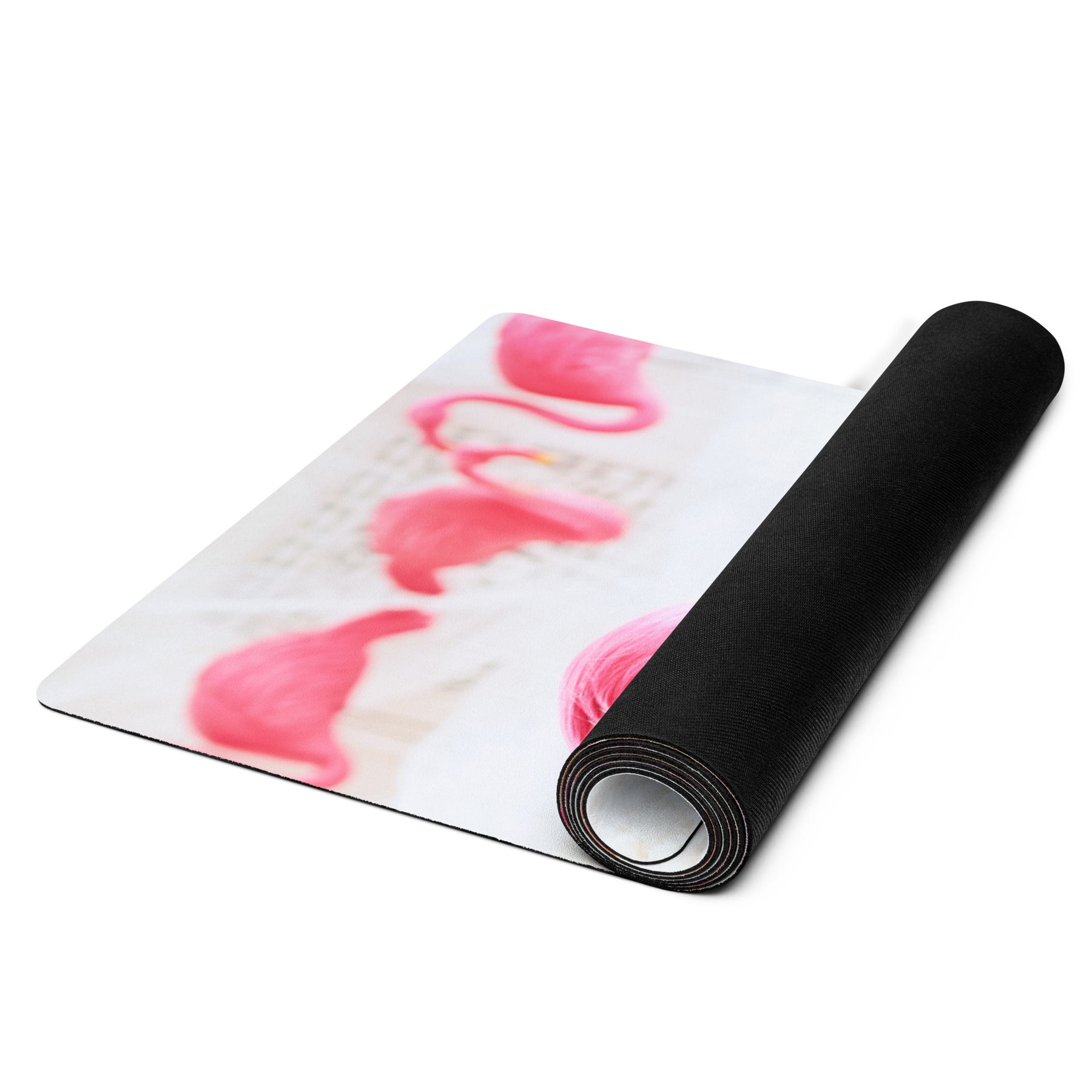 a rolled up yoga mat of a girl in a pink wig with pink flamingos