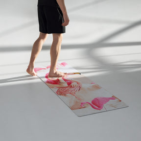 a room view with a man standing on a yoga mat of a girl in a pink wig with pink flamingos