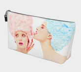 canvas make up bag with the image of two young girls with cotton candy hair. One is eating the other ones hair